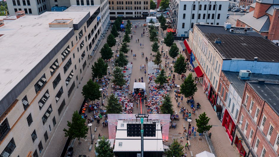 A lively aerial view of a street festival in Chattanooga, Tennessee showcasing vibrant crowds and urban architecture.